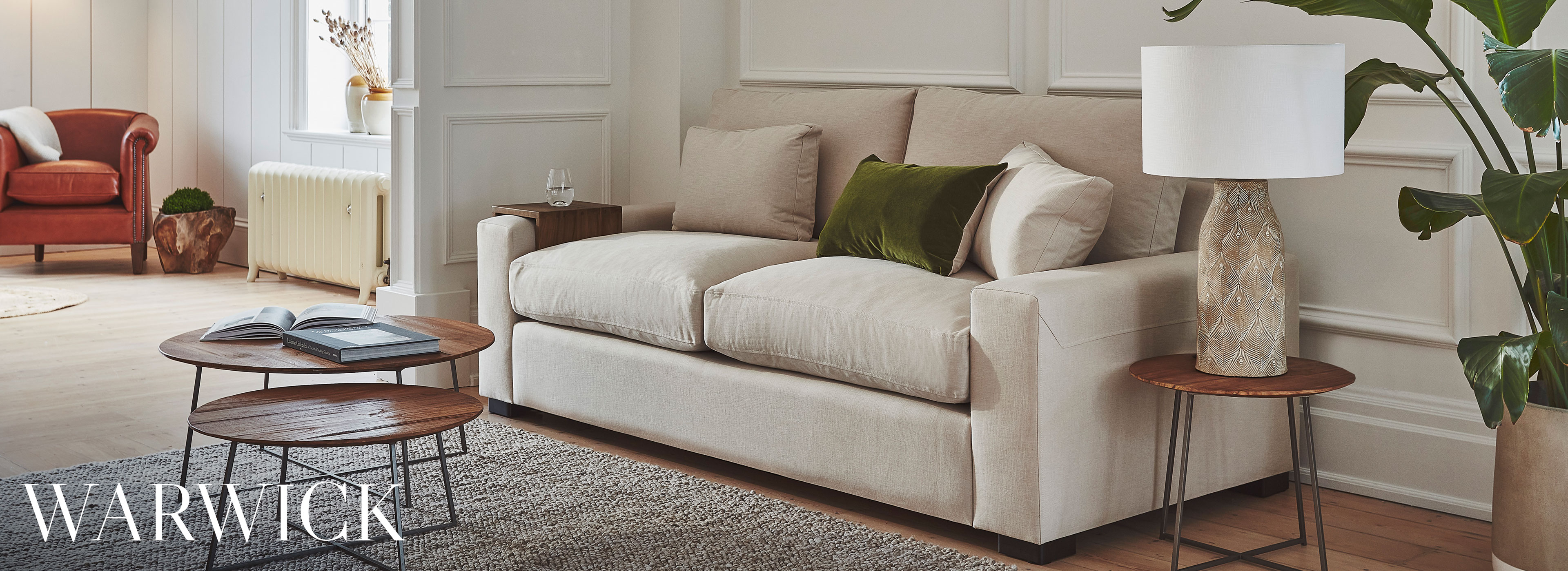 Wide padded arms, Envelope detail on arms, Low-lying contemporary design 