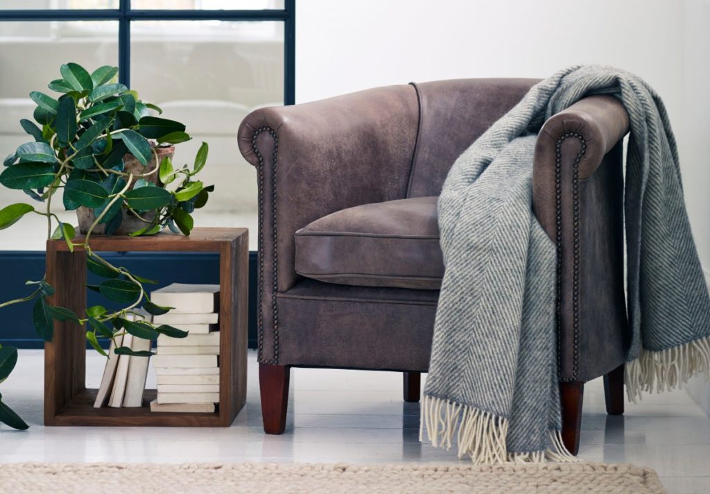 Tub chair with lambswool herringbone throw