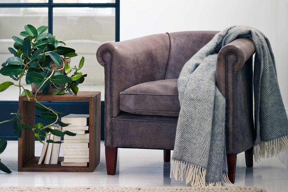 Self care with house plants, stylish storage cube and tub chair